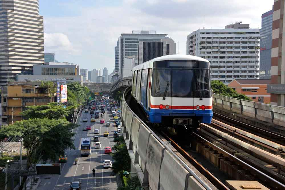 How to Spend a Month in Thailand: Best 1 Month in Thailand Itinerary 2 BTS Skytrain on the tracks in Bangkok, Thailand on a sunny day