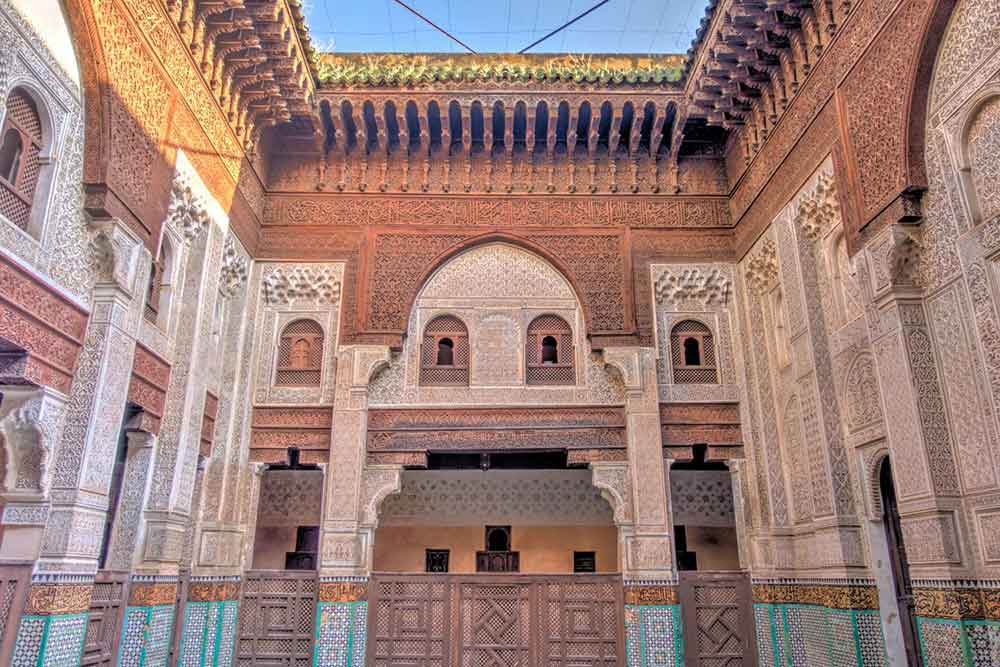 Mausoleum of Moulay Ismail - showcases the exquisite craftmanship and intricate details as the wall are delicate with geometric patterns in a brown and white color