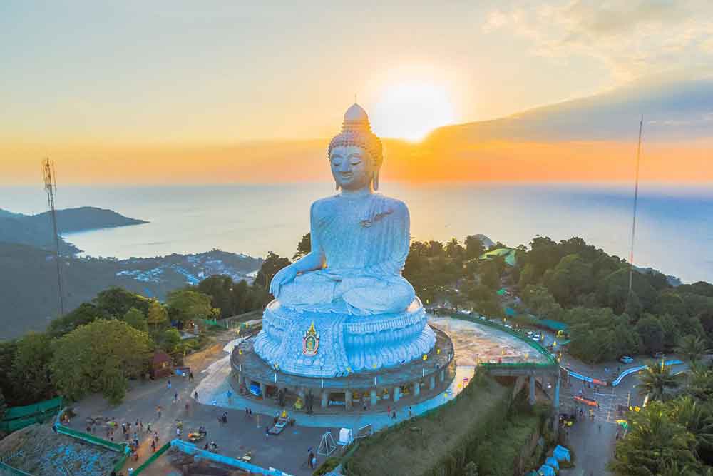 How to Spend a Month in Thailand: Best 1 Month in Thailand Itinerary 19 The Big Buddha Statue over the mountain at sunset in Phuket, Thailand