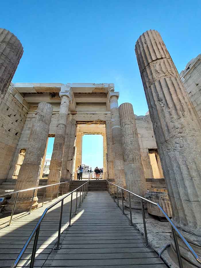 Tour the Acropolis Without the Crowds: Pristine Parthenon Early Morning Acropolis Tour, Athens 5 Columns stands at The Propylaea with a blue sky in a background