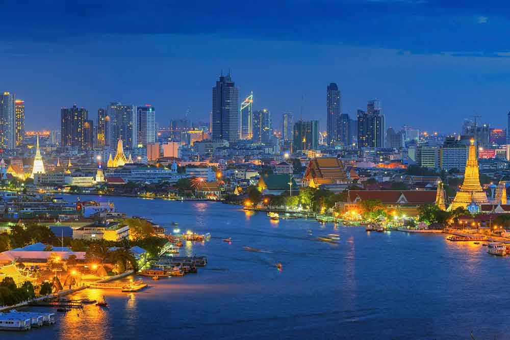 How to Spend a Month in Thailand: Best 1 Month in Thailand Itinerary 3 View of Bangkok City Skyline at night with buildings, houses, temples and sea at the middle of the city
