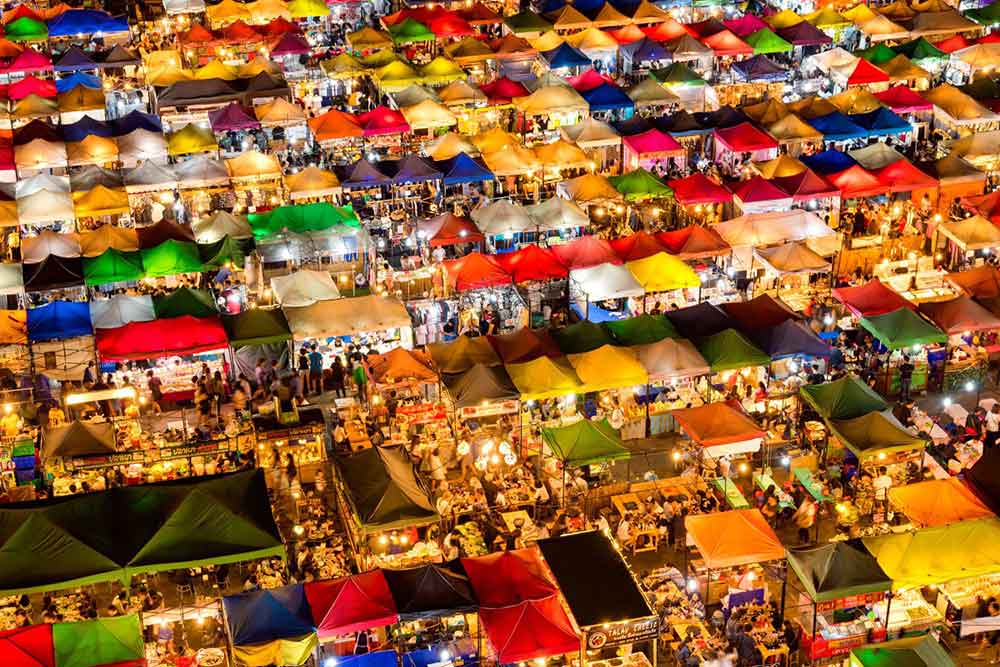 Is Bangkok Worth Visiting? 16 Great Reasons to Visit Bangkok 11 Aerial view of Chatuchak weekend market with colorful food stalls and shops at night