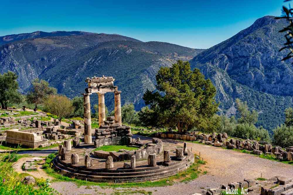 The ruins of Delphi showcase The Temple of Apollo with its scattered columns and fragments of intricate carvings with a stunning panoramic views of the landscape mountains
