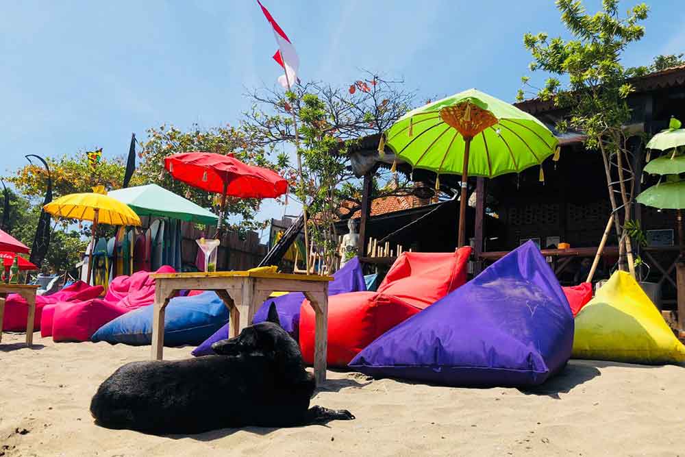 Seminyak Beach with colouful beanbags and umbrellas