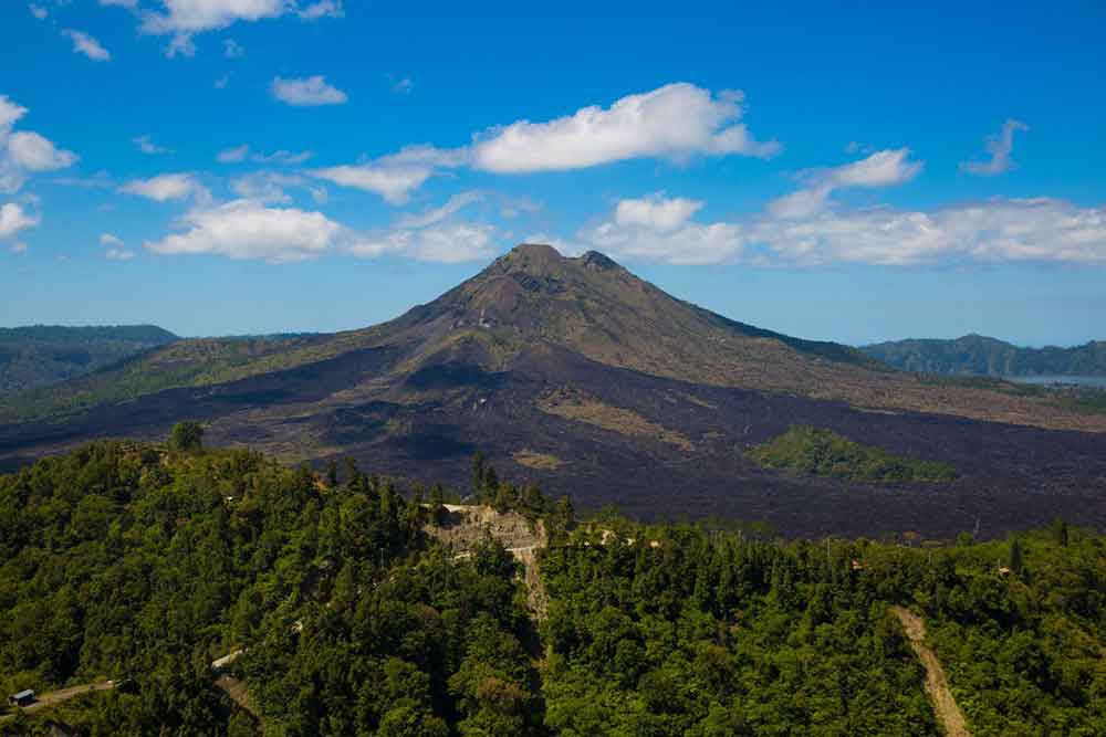 Mount Agung, a majestic volcano covered with dense tropical forests in a slope area