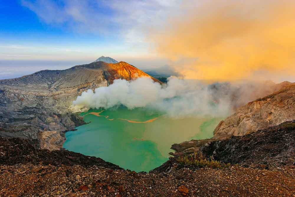 Sunrise at Ijen Volcano Java with its amazing turquoise lake with white smoke