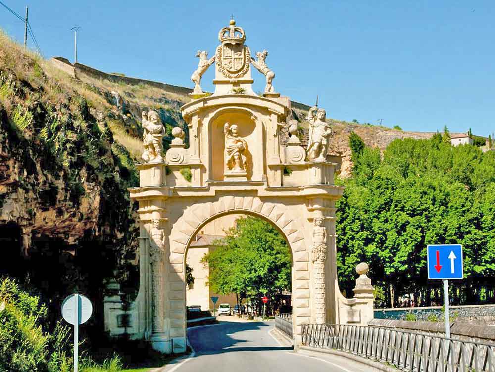 Is Segovia Worth Visiting? How to Visit Segovia From Madrid in a Day 14 The Arevalo Gate in Segovia showcases an archway with carved statues at the top