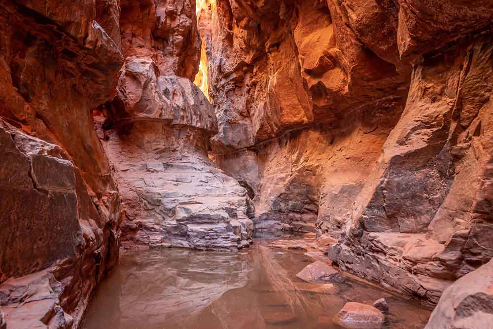 7 Best Wadi Rum Jeep Tours, Jordan: Choosing the Best 4x4 Wadi Rum Experience 10 Khazali Canyon located in the Wadi Rum Desert showcases the natural wonder with its towering rock formations, narrow winding passage and water at the the middle of rock formation