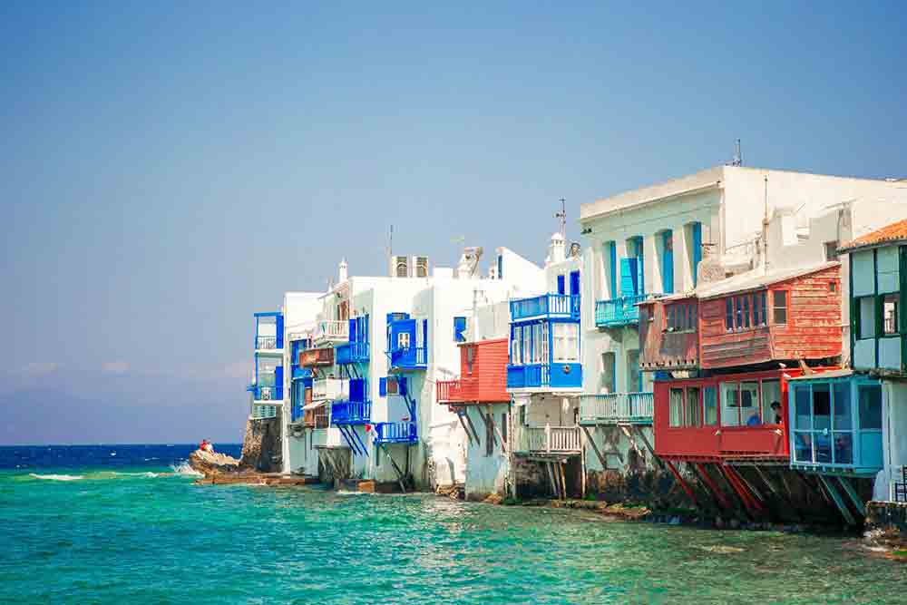 Little Venice on Mykonos Island with the colourful houses sitting next to the sea.
