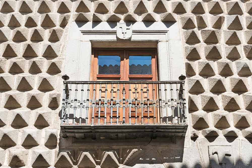 Is Segovia Worth Visiting? How to Visit Segovia From Madrid in a Day 11 Casa De Los Picos, covered in hundreds of granite pyramid-shaped blocks with balcony at the center