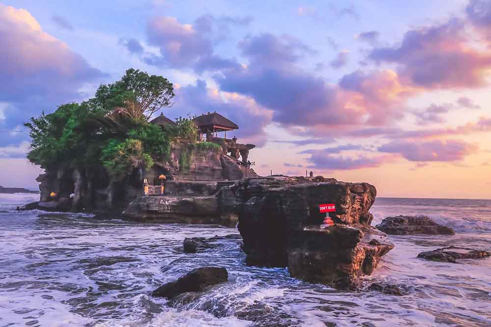 Tanah Lot Temple with sunset in the background