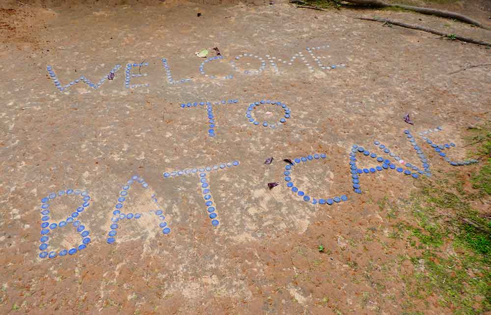 Bukit Lawang Jungle Trekking, Sumatra Orangutan Tour: How to See Bukit Lawang Orangutans 24 Blue Bottle top sign near the Bat cave entrance