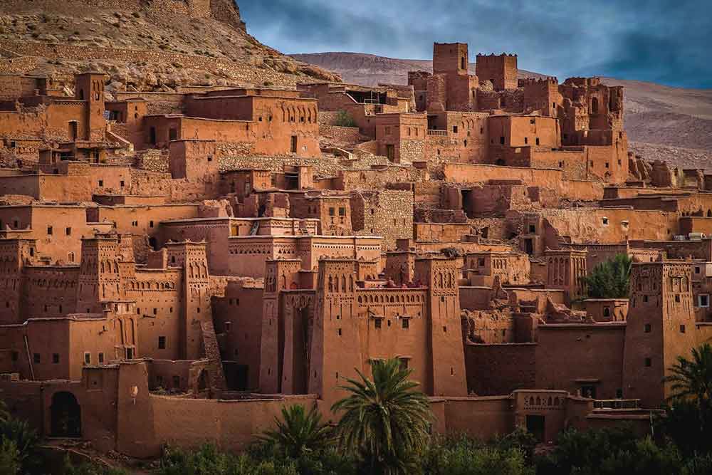 Ait Ben Haddou, Morocco An aerial view of the Ait Ben Haddou in Morocco showcasing its mud brick buildings in reddish-brown color | Is Morocco in europe