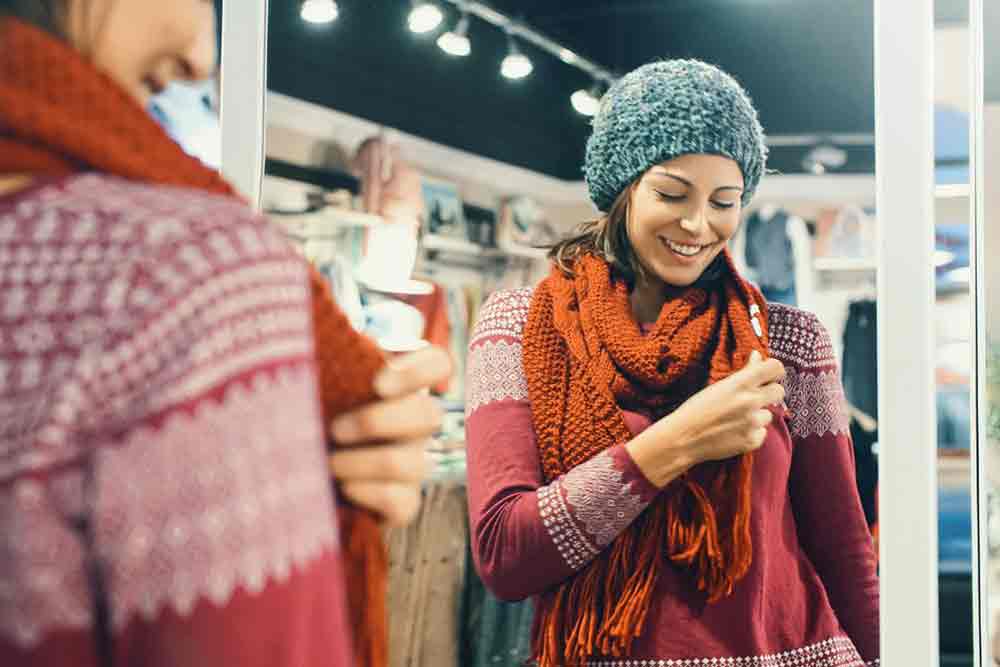 Best Packing for Winter in Europe Guide: Hand Luggage Only Packing List for Winter in Europe 2 Woman wearing a scarf and cap during winter season are essential for Guide to Packing for Winter in Europe