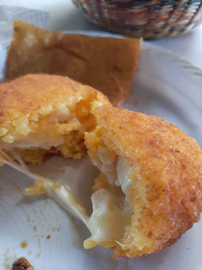 Arancini street food, the vegetarian of a cheese and rice filled ball. 