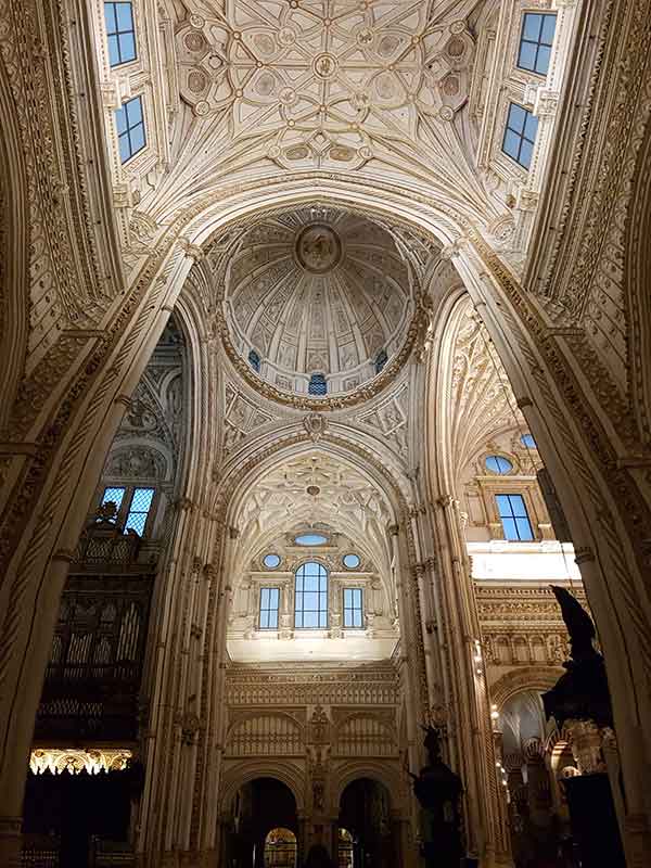 The central dome of the Mezquita. I took this photo looking up at it. You can clearly see the difference in style of the Capilla Major, with it's white stone and more Renaissance style. There are windows high up letting in light.