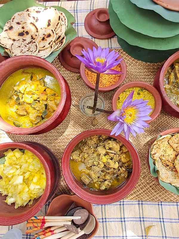 Bowls of traditional Sri Lankan food laid out on the table. 