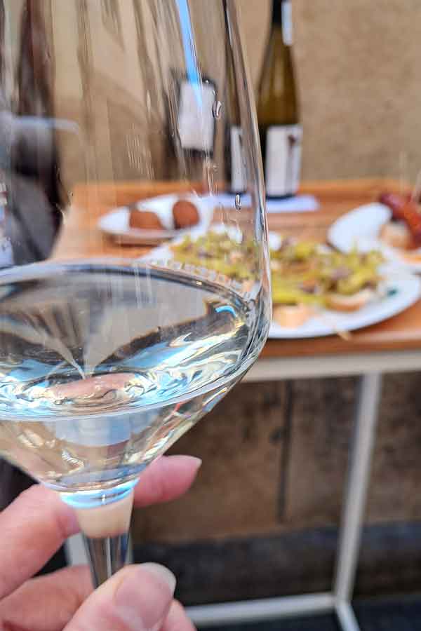 Local txakoli wine with pintxos in San Sebastian.