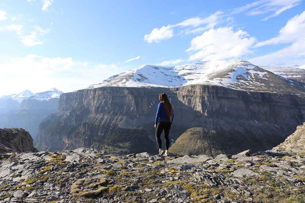 Me looking out over the snow capped mountais in Ordesa y Monte Perdido National Park.