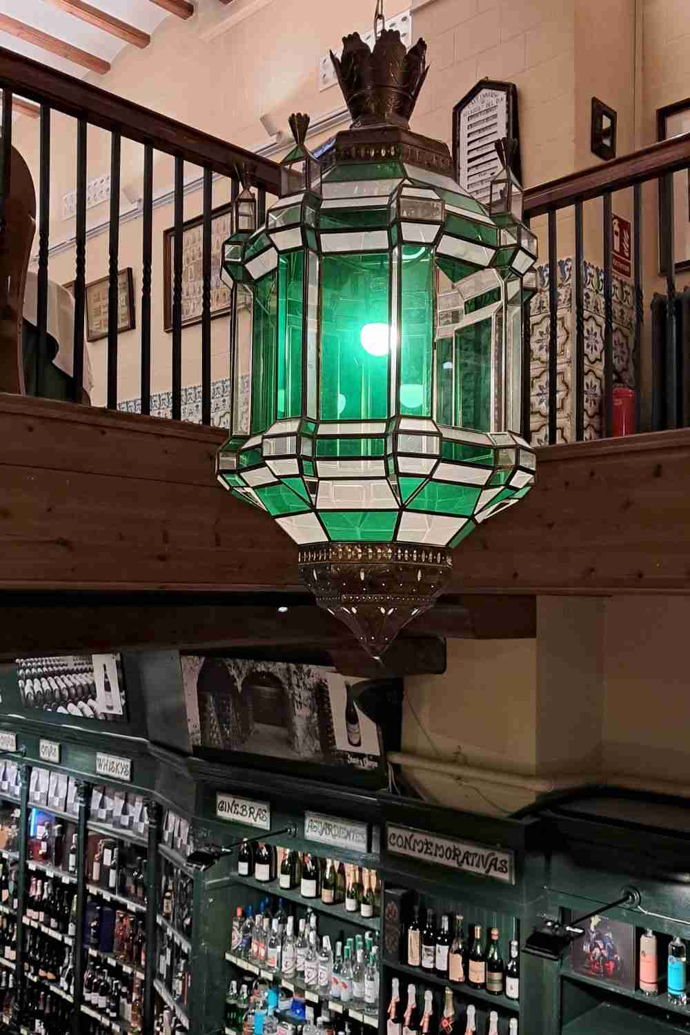 The vaulted ceiling inside Restaurante Montal in Zaragoza looking down on shelves filled with local products.