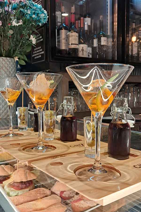 Three glasses of spirit mix with vermut in little bottles. 