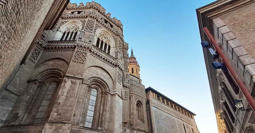 Looking up at La Seo Cathedral with decorative Mudejr architecture. One of the best things to see in Zaragoza.