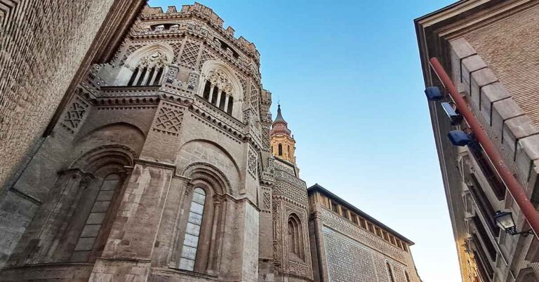 Looking up at La Seo Cathedral with decorative Mudejr architecture. One of the best things to see in Zaragoza.