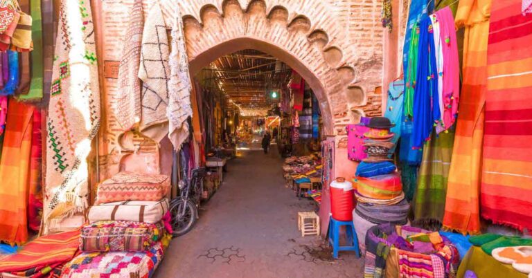A decorative archway into the souks in Marrakech. This is the featured image for an article about the best souvenirs from Morocco.