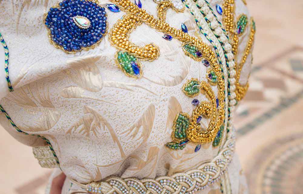 Closeup of detailed beadwork on a Moroccan kaftan