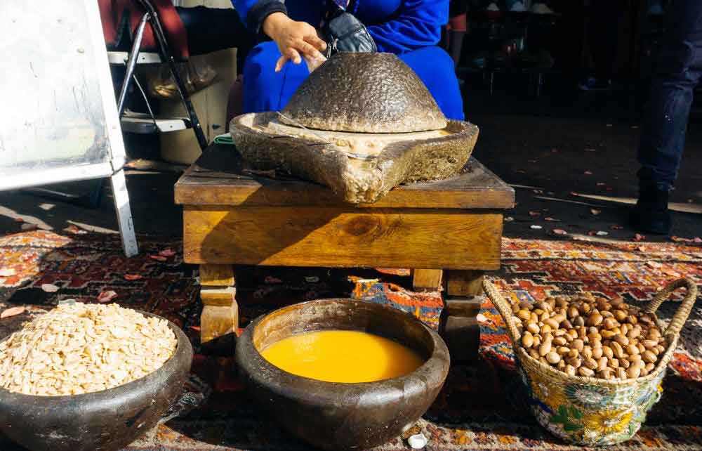 Woman producing Argan oil
