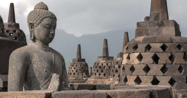 Seeing the sunrise over the temple of Borobudur in Indoesia is one of the world's best ancient ruins to see once in your life.