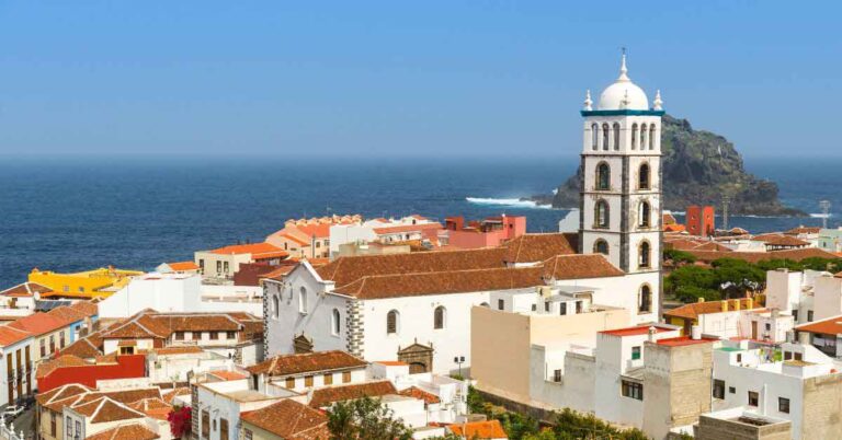 Historic coastal town of Garachico in Tenerife, Canary Islands, with volcanic rock pools, whitewashed buildings, and the Atlantic Ocean in the background — a perfect snapshot for travellers wondering where’s the warmest place in Spain in winter.