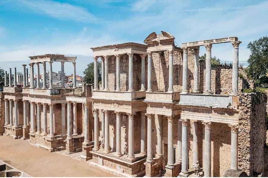 The Roman theatre in Mérida, Spain, featuring tall Corinthian columns and well-preserved stone architecture from the first century BC.