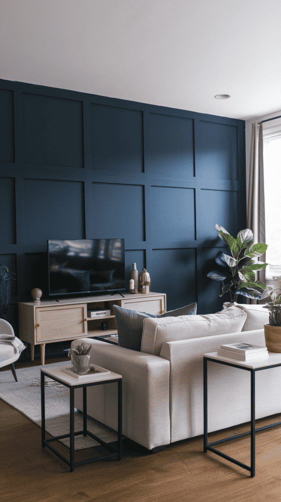 A living room with a striking navy blue painted wall behind a neutral sofa and modern furniture, capturing a minimalist but bold design.