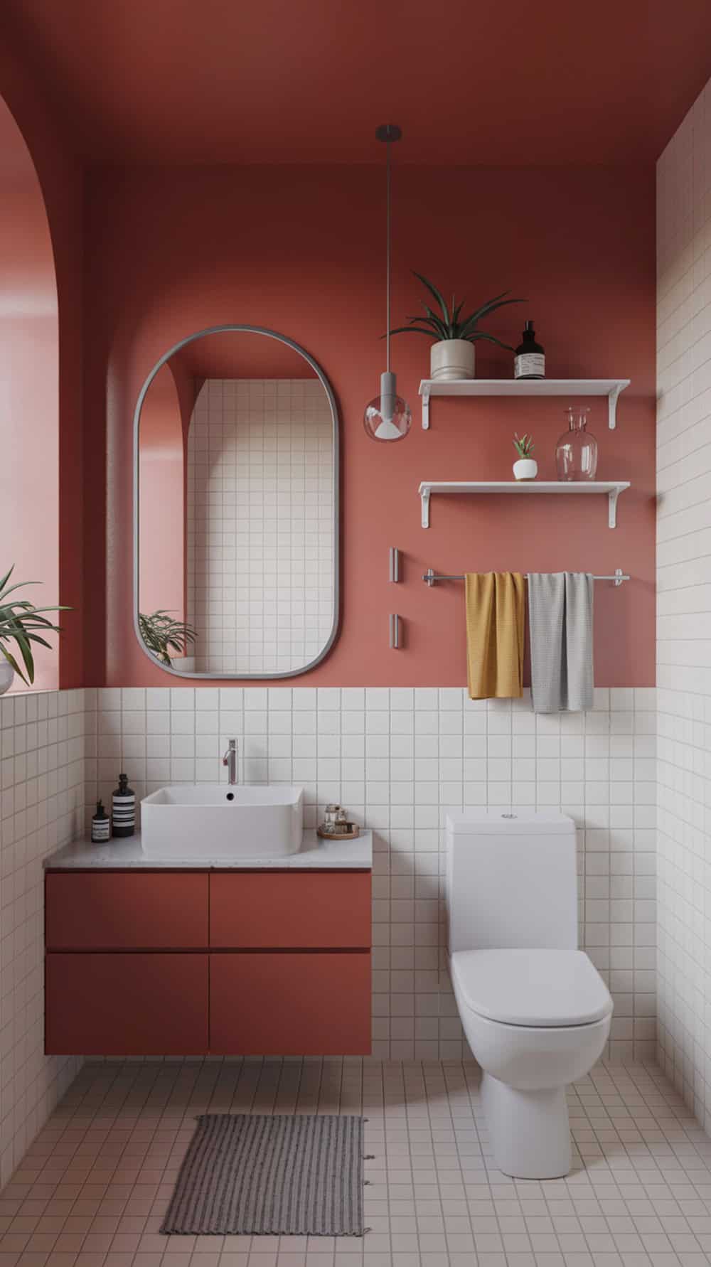 A modern bathroom featuring a terracotta accent wall, white tiles, and stylish decor.