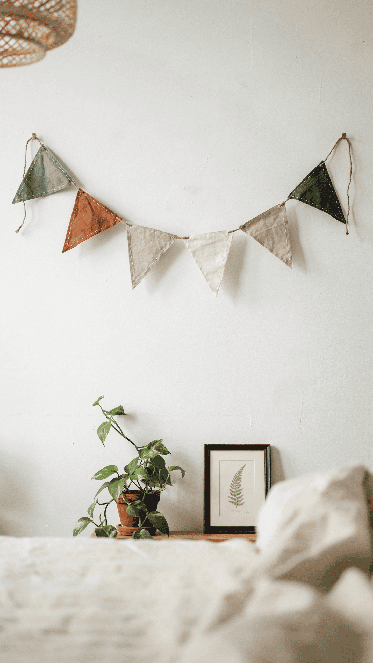 Handmade fabric garland decorating a cozy bedroom wall