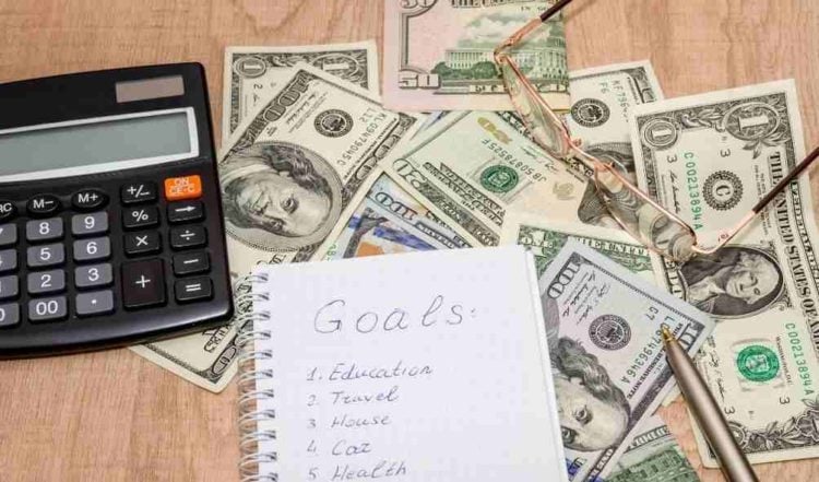 Financial goal concept with calculator