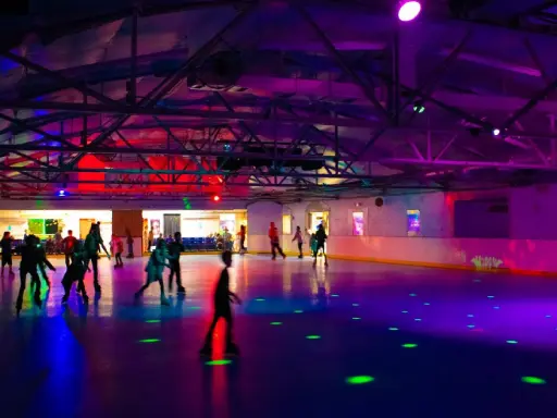 A fun and lively place where people are roller skating together, just like the excitement of a new Mid State Baths bathroom remodel.