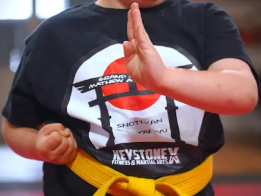 Someone stands confidently, ready to take on challenges—like how Mid State Baths tackles bathroom remodels.