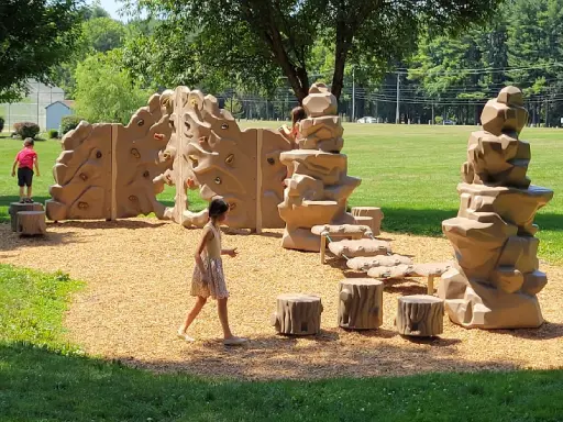 Children enjoy playing on a nearby playground, showing the family-friendly area close to Mid State Baths in York, PA.