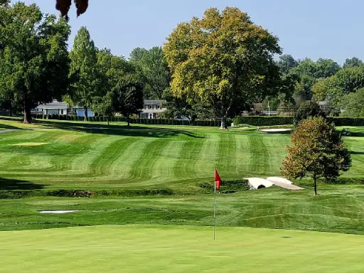 A peaceful golf course with homes in the background, showing where Mid State Baths has installed new showers.