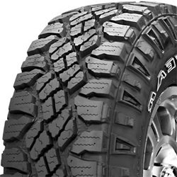 Off-road tire with rugged tread pattern for all-weather use.