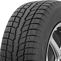 Close-up of a winter tire with detailed tread pattern for snow and ice traction.