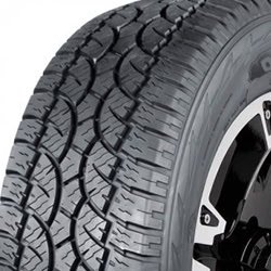 Close-up of a rugged tire with deep tread for off-road performance.