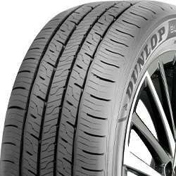 Dunlop tire close-up showing tread pattern and sidewall details.