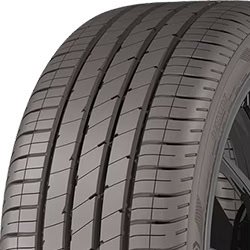 Close-up of Migo Tire Corp. commercial truck tire with detailed tread pattern.