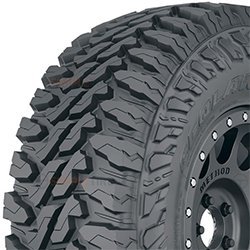 Off-road tire with aggressive tread pattern for rugged terrain.