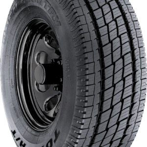 Heavy-duty truck tire with detailed tread pattern for durability and traction.