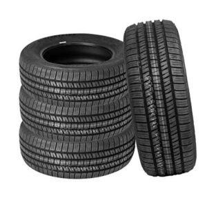 Stack of five black car tires with detailed tread patterns.