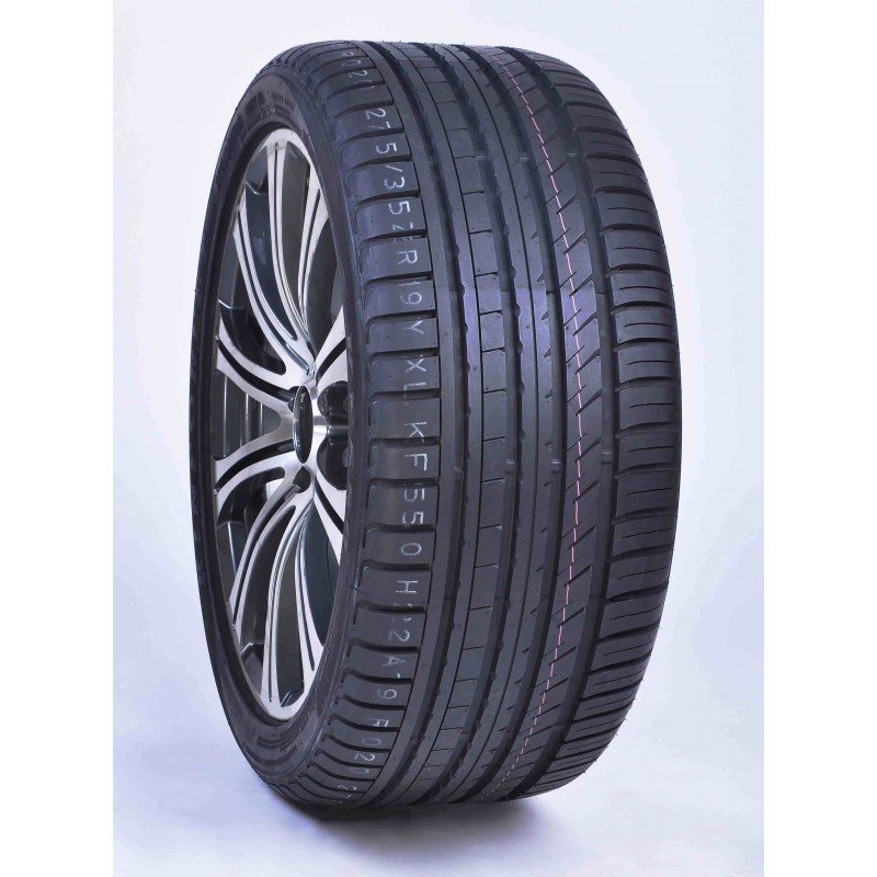 New car tire with alloy wheel on white background.